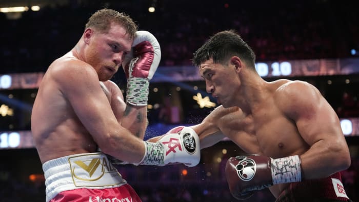 Canelo Alvarez absorbs a punch from Dmitry Bivol